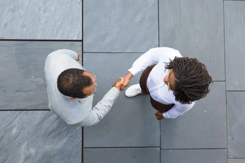 Two business partners shaking hands